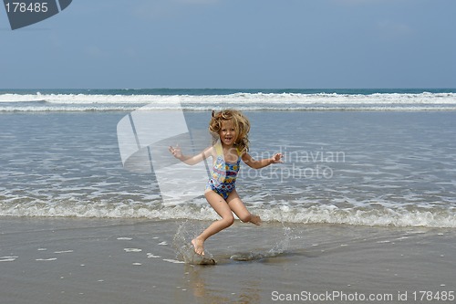 Image of jumping child on the beach