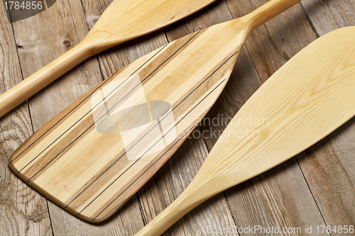 Image of wooden canoe paddles