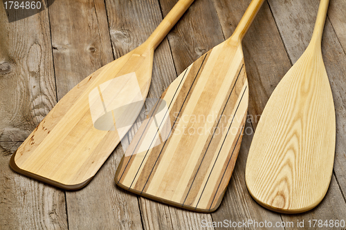 Image of wooden canoe paddles