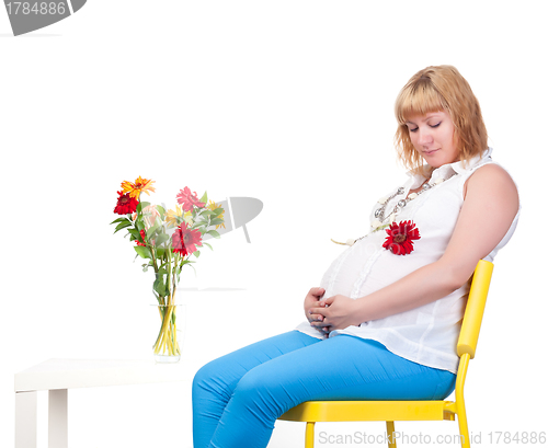 Image of Pregnant Woman with Flowers