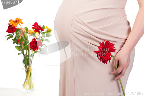 Image of Pregnant Woman with Flowers