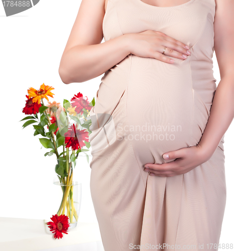 Image of Pregnant Woman with Flowers