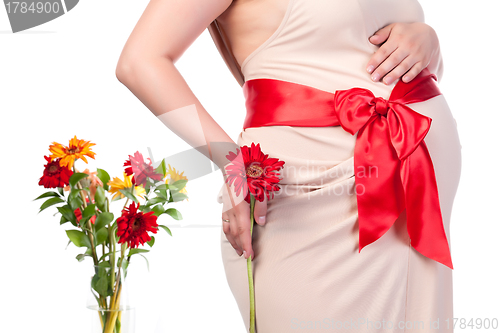 Image of Pregnant Woman with Flowers