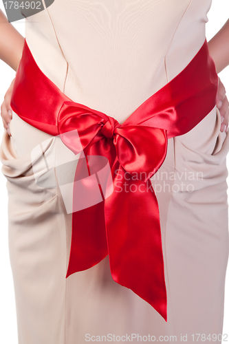 Image of Pregnant Woman's Belly with Red Ribbon