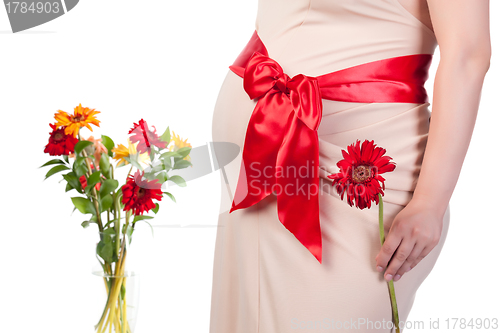 Image of Pregnant Woman with Flowers