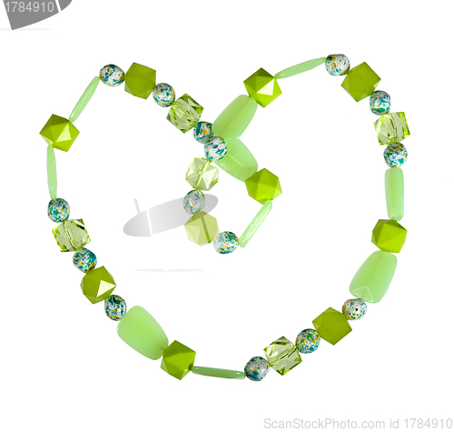 Image of Beads of green glass on a white background