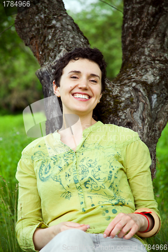 Image of happy female in the garden