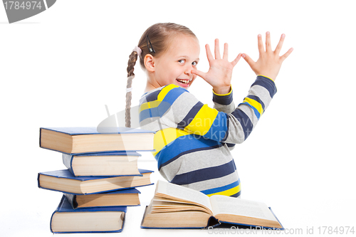 Image of schoolgirl with books being teased on isolated white