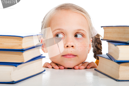 Image of girl  choosing the books on isolated white