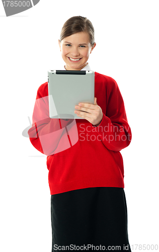 Image of Confident girl using wireless portable device