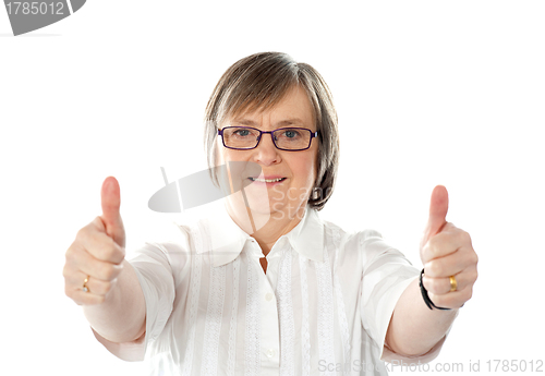 Image of Female gesturing double thumbs up