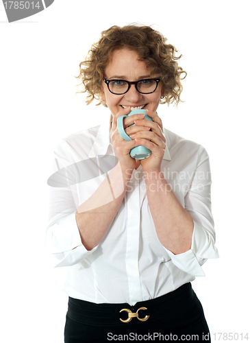 Image of Female executive drinking coffee