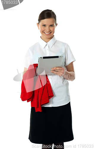 Image of Pretty teenager posing with wireless tablet pc