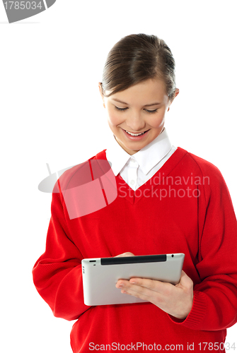 Image of Happy young girl using tablet pc