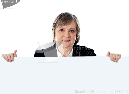 Image of Female businessperson showing big ad banner