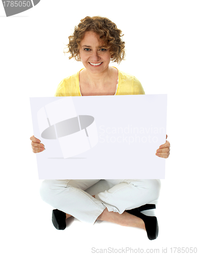 Image of Isolated woman holding blank banner ad