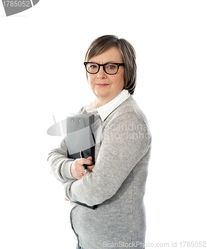 Image of Aged woman holding business documents