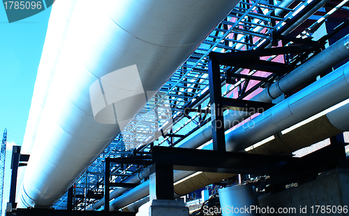 Image of Industrial zone, Steel pipelines and valves against blue sky