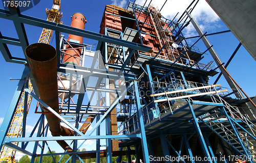 Image of cranes and beams on construction of industrial factory