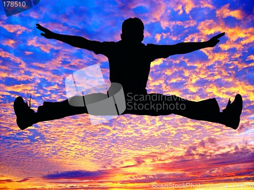 Image of Boy jumping high in the air