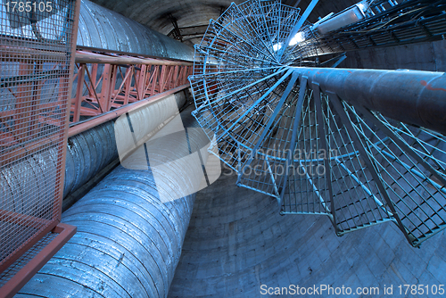 Image of Equipment, cables and stairs as found inside of  industrial powe