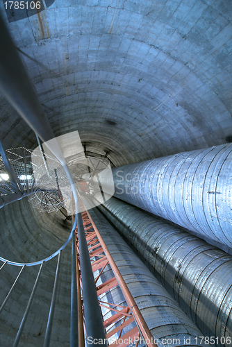 Image of Equipment, cables and stairs as found inside of  industrial powe