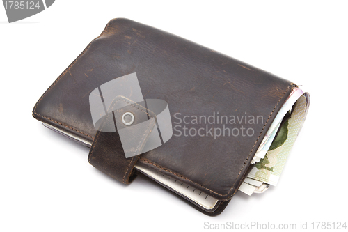 Image of Brown wallet with currency 