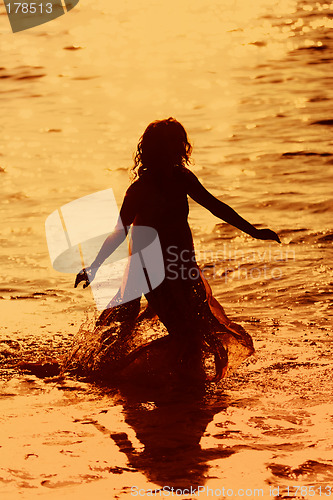 Image of Girl running in the water