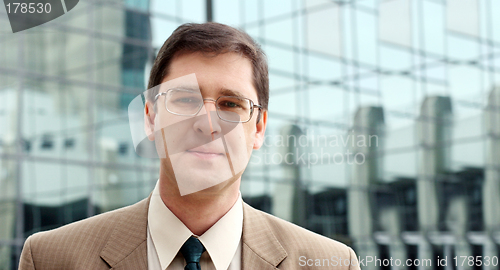 Image of Young businessman in front of the office building