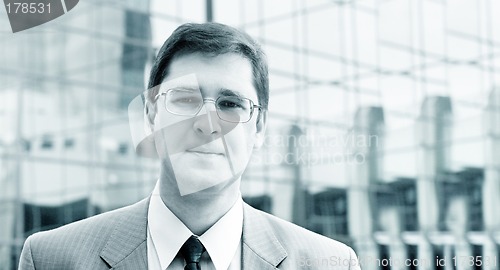 Image of Young businessman in front of the office building