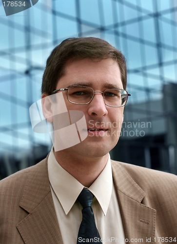 Image of Young businessman in front of the office building
