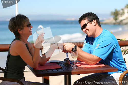 Image of Happy couple at a seaside cafe