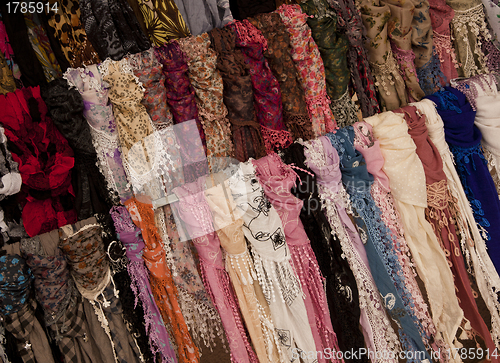 Image of Multicoloured scarves on market