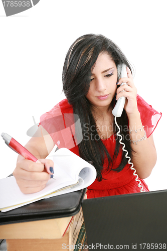 Image of Busy businesswoman using mobile phone and take note