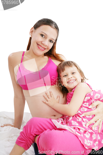 Image of Beautiful pregnant woman with her daughter