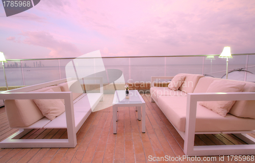 Image of Stunning view of outdoor chairs and a couch to enjoy the sunset 