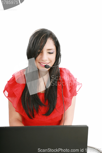 Image of Young Woman with a headset and computer at Hotline.