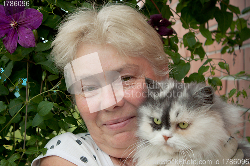 Image of A housewife and her pet cat
