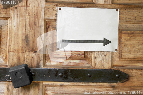 Image of Lock on a door and a note by