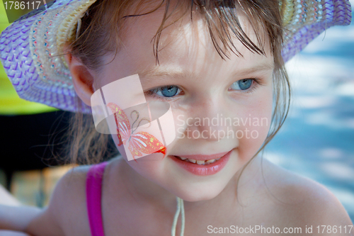 Image of Little girl with a picture on the cheek