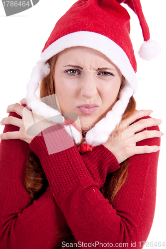 Image of smiling young woman at christmastime in red clothes isolated