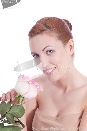 Image of beautiful young woman holding pink rose isolated