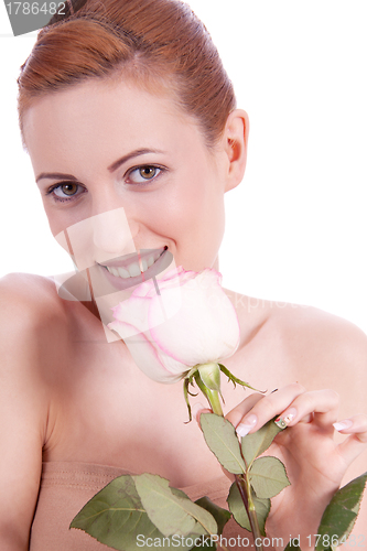 Image of beautiful young woman holding pink rose isolated