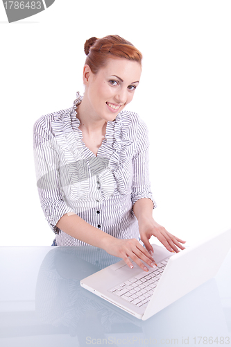 Image of young business woman on computer with snack isolated 