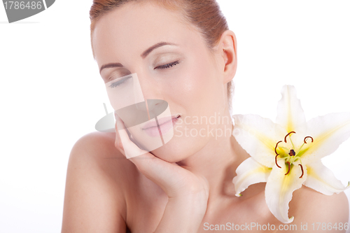 Image of beautiful natural woman face with flower isolated 