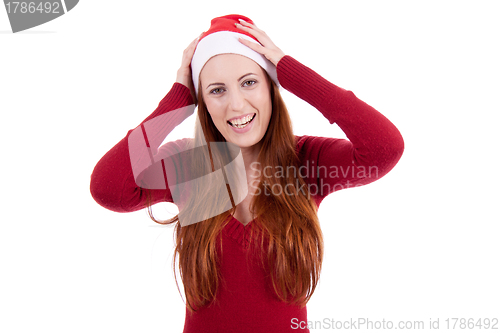 Image of smiling young woman at christmastime in red clothes isolated