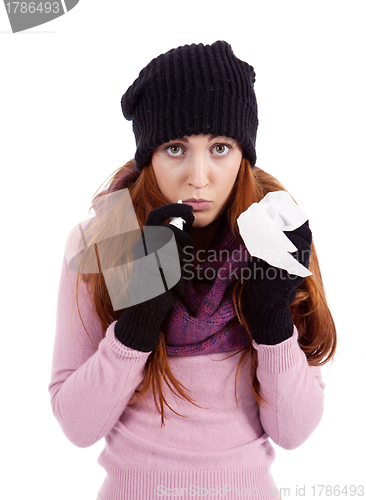 Image of woman with tissue and spray feels unwell with flu