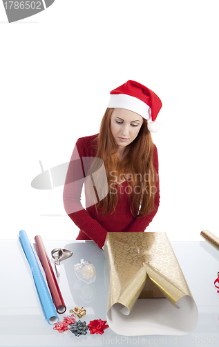 Image of young woman is packing  present for christmas isolated