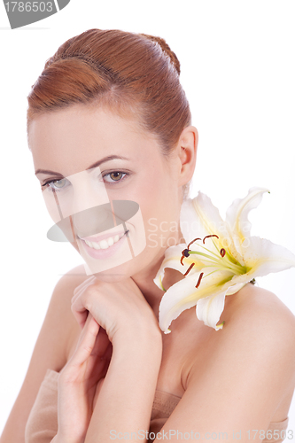 Image of beautiful natural woman face with flower isolated 