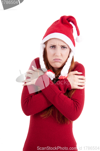 Image of smiling young woman at christmastime in red clothes isolated